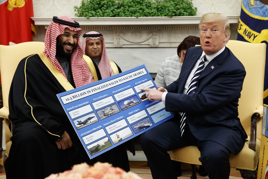 FILE - In this March 20, 2018 file photo, President Donald Trump shows a chart highlighting arms sales to Saudi Arabia during a meeting with Saudi Crown Prince Mohammed bin Salman in the Oval Office o ...