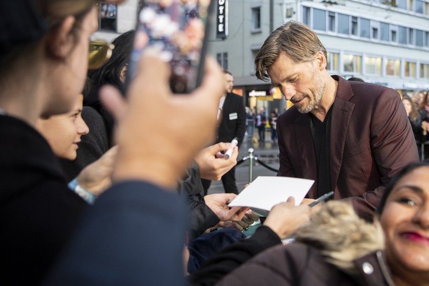 epa07899117 Danish actor Nikolaj Coster-Waldau signs on the Green Carpet during the 15th Zurich Film Festival (ZFF) in Zurich, Switzerland, 05 October 2019. The festival runs from 26 September to 06 O ...