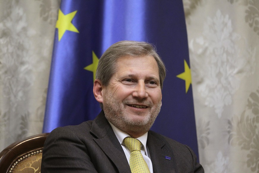 epa06503247 European Commissioner for Enlargement Negotiations Johannes Hahn smiles during the meeting with Serbian Prime Minister Ana Brnabic (not seen) in Belgrade, Serbia, 07 February 2018. Hahn sa ...
