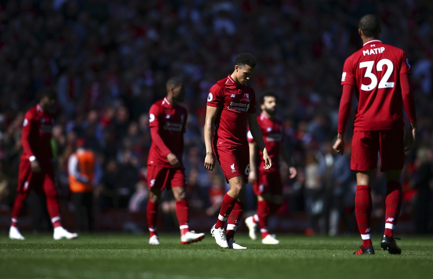 Liverpool players come out for the second half during the English Premier League soccer match between Liverpool and Wolverhampton Wanderers at the Anfield stadium in Liverpool, England, Sunday, May 12 ...