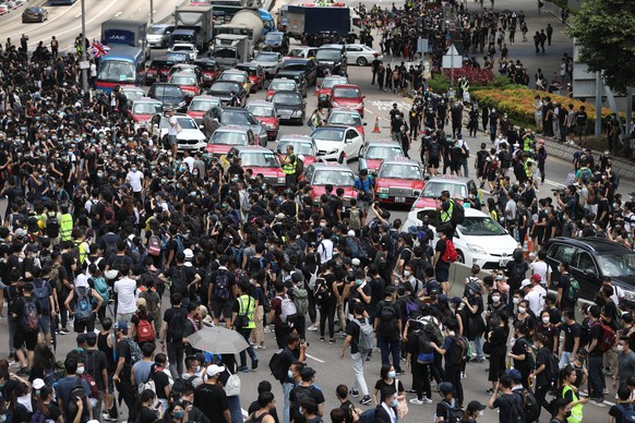 epa07662209 Protesters block a main road outside government buildings in Hong Kong, China, 21 June 2019. Hong Kong is braced for new demonstrations as the government did not respond to a list of prote ...