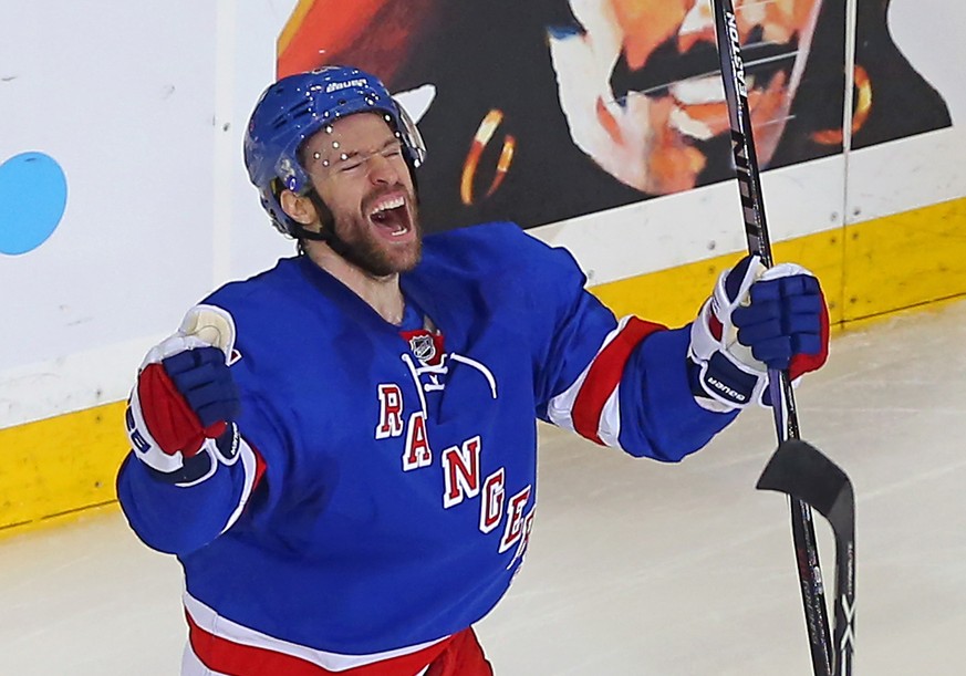 May 16, 2015; New York, NY, USA; New York Rangers center Dominic Moore (28) celebrates after scoring the game-winning goal to defeat the Tampa Bay Lightning 2-1 in game one of the Eastern Conference F ...