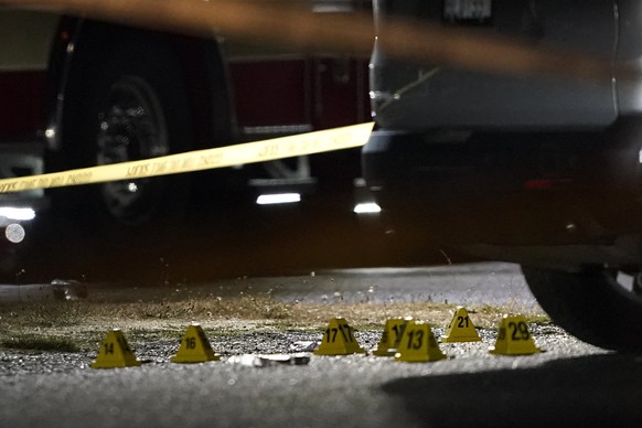 Evidence markers are placed on the ground Thursday, Sept. 3, 2020, in Lacey, Wash. at the scene where Michael Reinoehl was killed Thursday night as investigators moved in to arrest him. Reinoehl had b ...