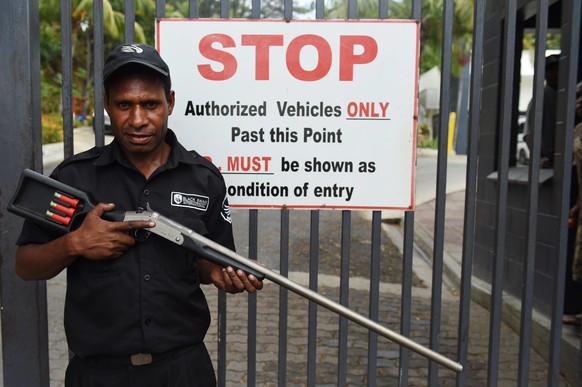 epa04924696 An armed security personnel stands guard outside the Airways Hotel during the hosting of the Pacific Islands Forum in Port Moresby, Papua New Guinea, 11 September 2015. The 16 member Pacif ...