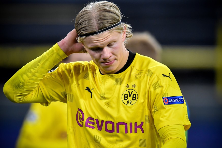 epa09135913 Dortmund&#039;s Erling Haaland reacts after conceding the 1-2 goal during the UEFA Champions League quarter final, second leg soccer match between Borussia Dortmund and Manchester City in  ...