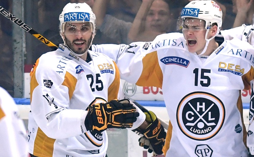 Lugano’s player Gregory Hofmann, center, celebrates the 1-2 goal with Lugano’s player Maxim Lapierre, left, and Lugano’s player Bobby Sanguinetti, right, during the preliminary round game of the Natio ...