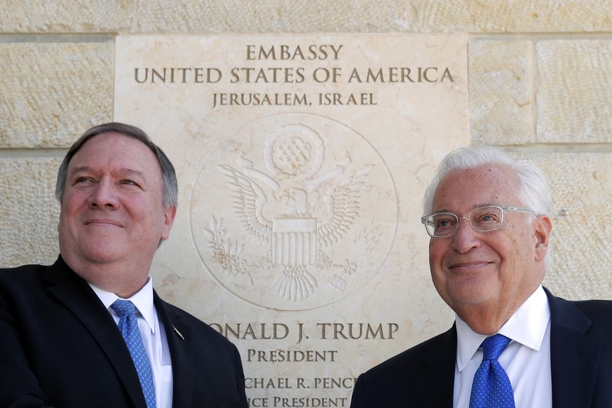 U.S. Secretary of State Mike Pompeo and U.S. Ambassador to Israel David Friedman stand next to the dedication plaque at the U.S. embassy in Jerusalem, Wednesday, March 21, 2019. (Jim Young/Pool Image  ...