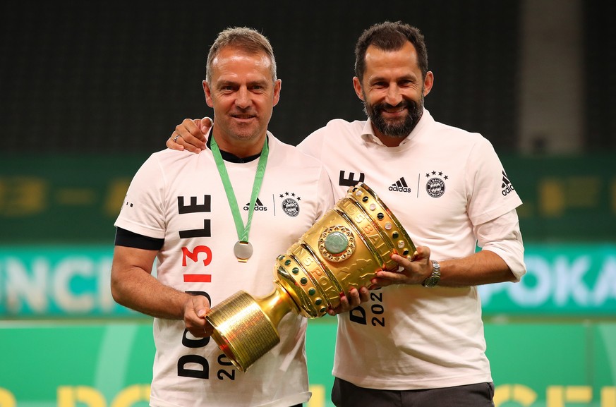 epa08527807 Bayern Munich&#039;s head coach Hansi Flick (L) and sports director Hasan Salihamidzic (R) pose with the trophy after winning the German DFB Cup final between Bayer 04 Leverkusen and FC Ba ...