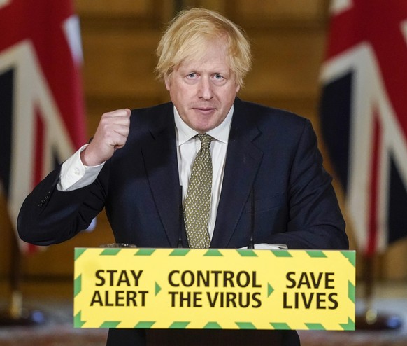 In this photo issued by 10 Downing Street, Britain&#039;s Prime Minister Boris Johnson speaks during a media briefing on coronavirus in Downing Street, London, Sunday May 24, 2020. Boris Johnson says  ...