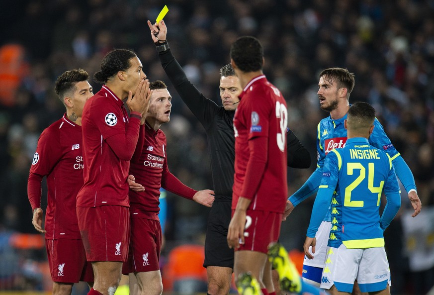 epa07224448 Liverpool&#039;s Virgil van Dijk (2-L) receives a yellow card during the UEFA Champions League Group C soccer match between Liverpool FC and SSC Napoli held at the Anfield in Liverpool, Br ...