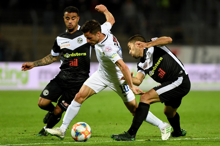 From left: Lugano&#039;s player Carlinhos Junior, Zurich&#039;s player Antonio Marchesano and Lugano&#039;s player Jonathan Sabbatini, during the Super League soccer match FC Lugano against FC Zurich, ...