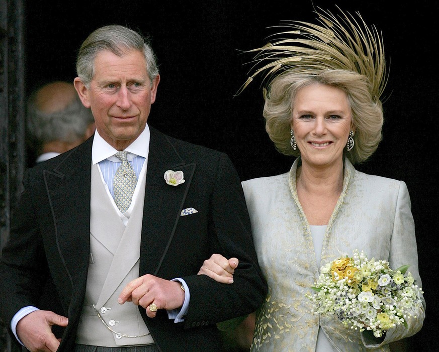 FILE - This is a Saturday, April 9, 2005 file photo of Britain&#039;s Prince Charles and his bride Camilla Duchess of Cornwall as they leave St George&#039;s Chaple in Windsor, England following the c ...