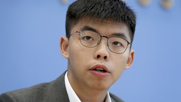 FILE - In this Sept. 11, 2019, file photo, Hong Kong activist Joshua Wong addresses the media during a press conference in Berlin, Germany. Wong on Tuesday said Hong Kong authorities have disqualified ...