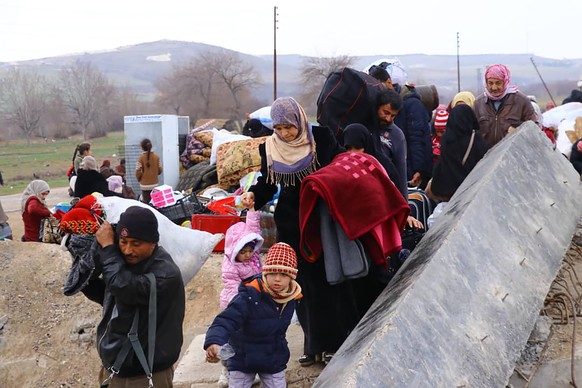 This photo provided on Jan. 30, 2020, by the Northern Democratic Brigade, a group of the US-backed Kurdish-led Syrian democratic forces, shows displaced Syrians who fled the Syrian military offensive  ...