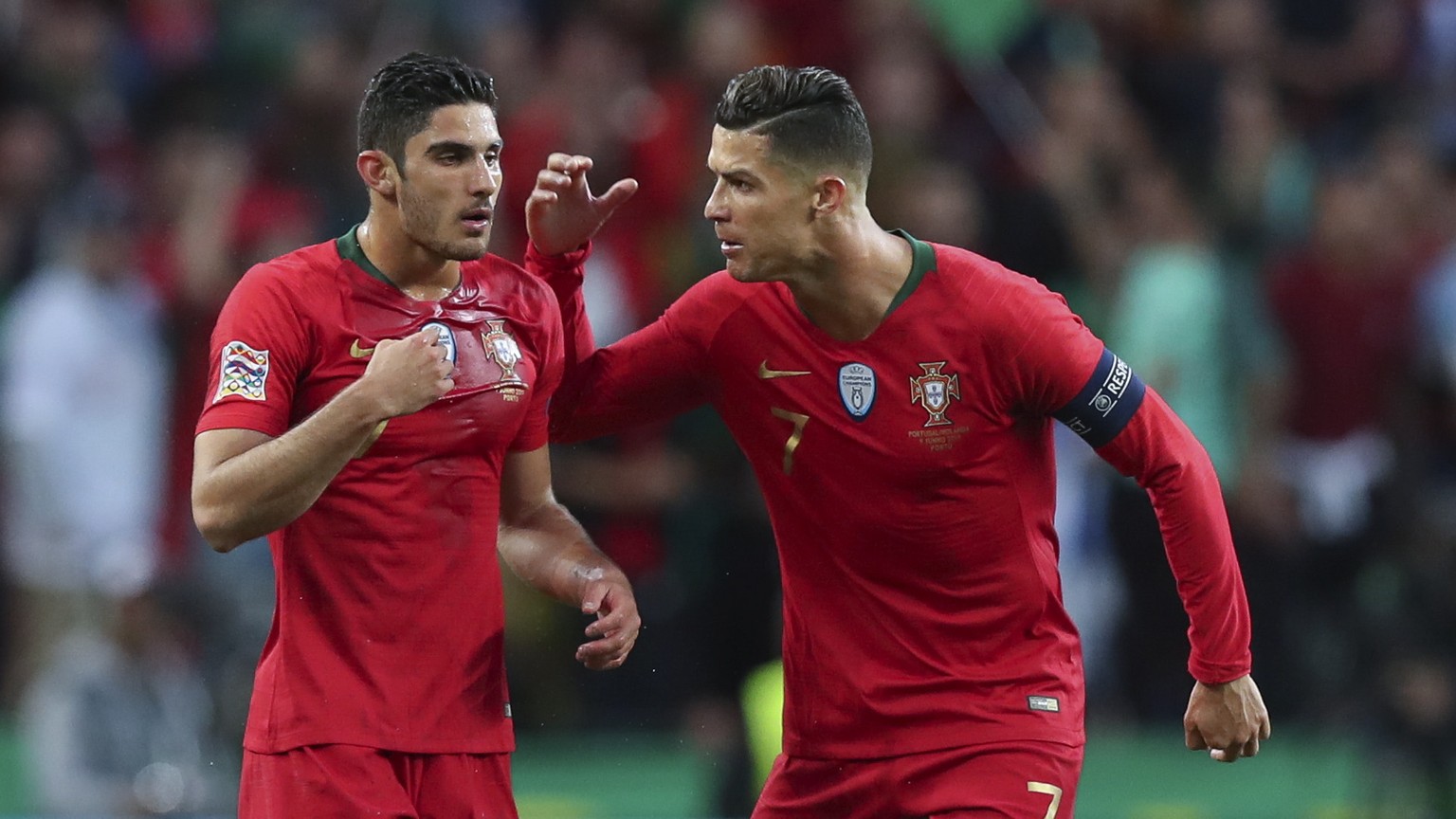 epa07637756 Portugal player Goncalo Guedes (L) celebrates with Cristiano Ronaldo after scoring the opening goal during the UEFA Nations League final soccer match Portugal vs Netherlands at Dragao stad ...