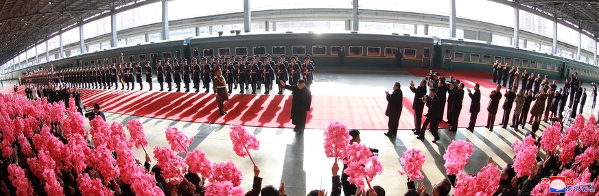 epa07391626 A photo released by the official North Korean Central News Agency (KCNA) shows North Korean leader Kim Jong-un (C) waves before boarding a train in Pyongyang, North Korea, 23 February 2019 ...