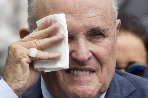 epa07883528 (FILE) - Attorney to US President Donald J. Trump Rudy Giuliani wipes his brow before the start of the White House Sports and Fitness Day at the South Lawn of the White House in Washington ...