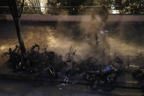 Charred vehicles are pictured after a fire near the Gare de Lyon train station Friday, Feb. 28, 2020 in Paris. Someone set fire to a scooter during an unauthorized concert near the train station, and  ...