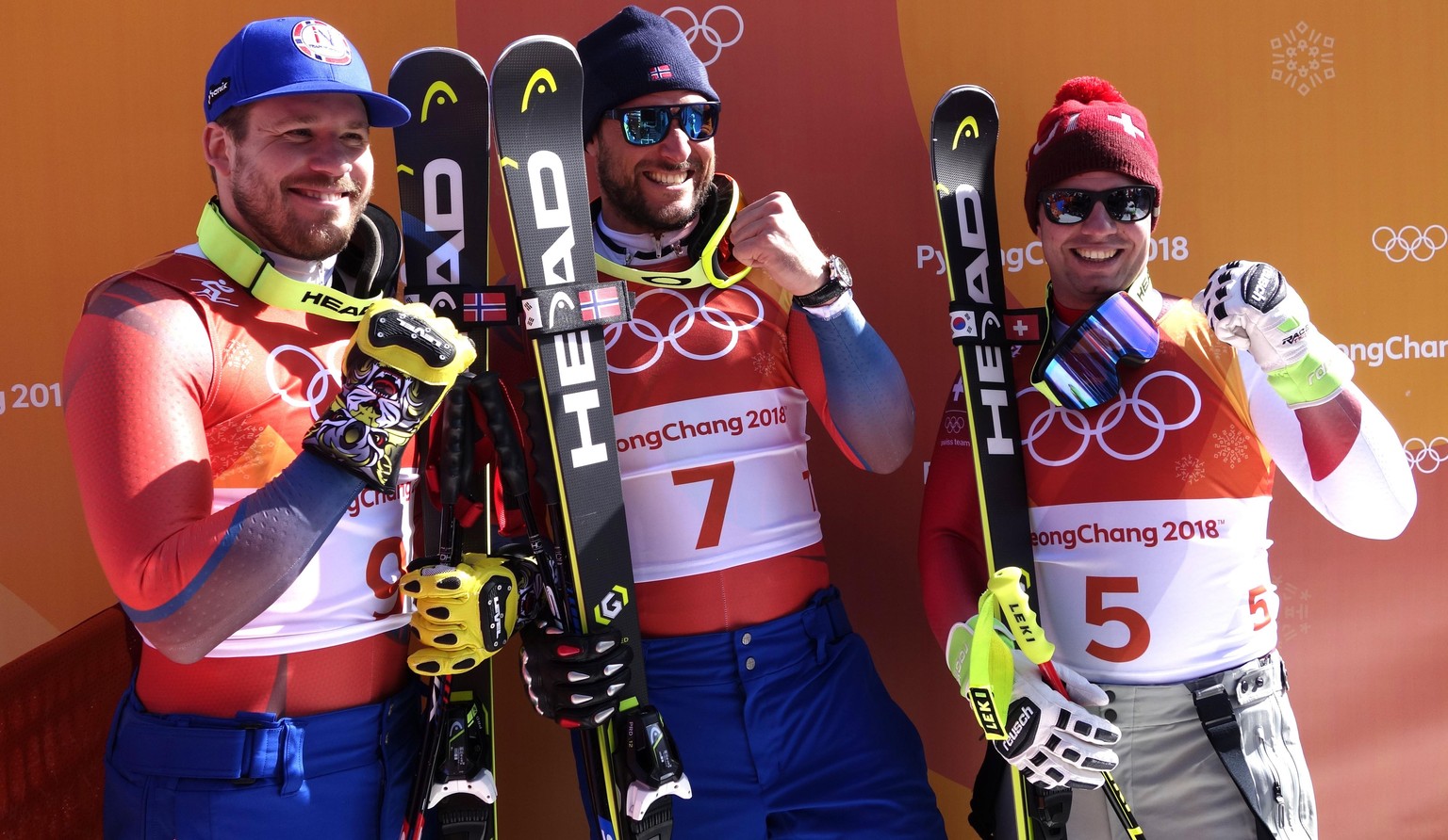 epa06526581 A handout photo made available by the International Skiing Federation (FIS) shows winner Aksel Lund Svindal of Norway, second placed Kjetil Jansrud (L) of Norway and third placed Beat Feuz ...