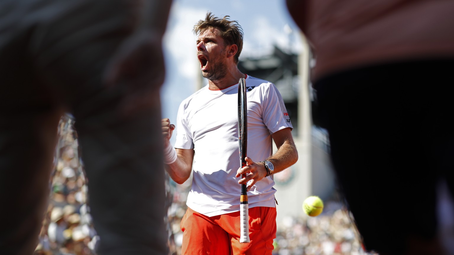 Switzerland&#039;s Stan Wawrinka screams after scoring a point against Greece&#039;s Stefanos Tsitsipas during their fourth round match of the French Open tennis tournament at the Roland Garros stadiu ...