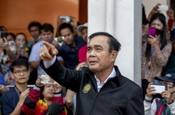 Thailand Prime Minister Prayuth Chan-ocha gestures during a press briefing after visiting victims of a mass shooting in Korat, Nakhon Ratchasima, Thailand, Sunday, Feb. 9, 2020. Thai officials say a s ...