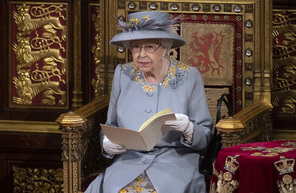 Britain&#039;s Queen Elizabeth II delivers the speech in the House of Lords during the State Opening of Parliament at the Palace of Westminster in London, Tuesday May 11, 2021. (Eddie Mulholland/Pool  ...