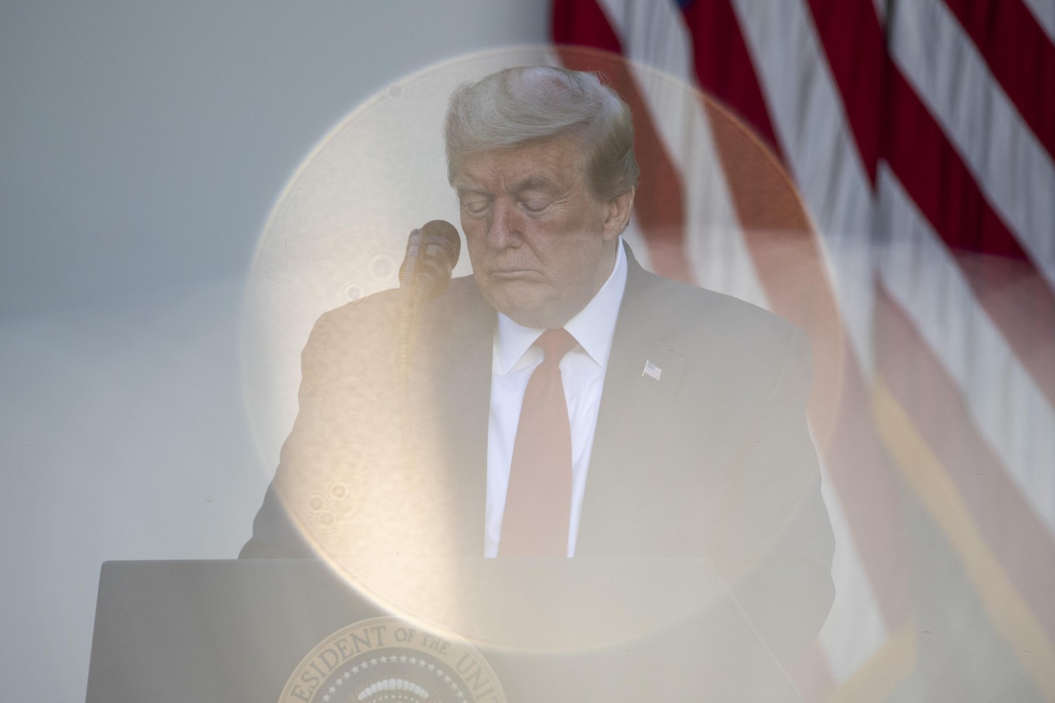 President Donald Trump bows his head in prayer during a White House National Day of Prayer Service in the Rose Garden of the White House, Thursday, May 7, 2020, in Washington. (AP Photo/Alex Brandon)
 ...