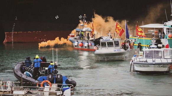 Fishing vessels at sea off the coast of Jersey, Thursday, May 6, 2021. French fishermen angry over loss of access to waters off their coast have gathered their boats in protest off the English Channel ...