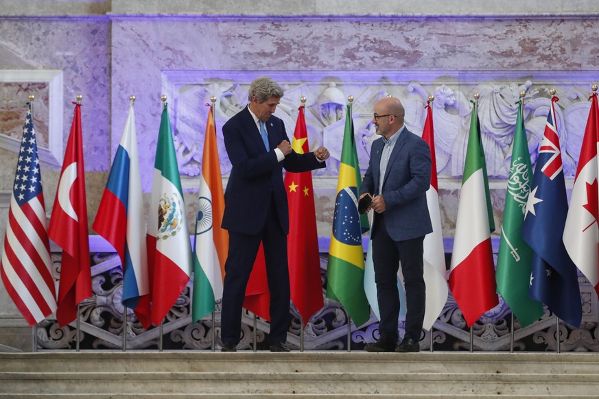 Special Presidential Envoy for Climate John Kerry and Italian Minister for Ecological Transition Roberto Cingolani pose during a photo opportunity at Palazzo Reale in Naples, Italy, Friday, July 23, 2 ...