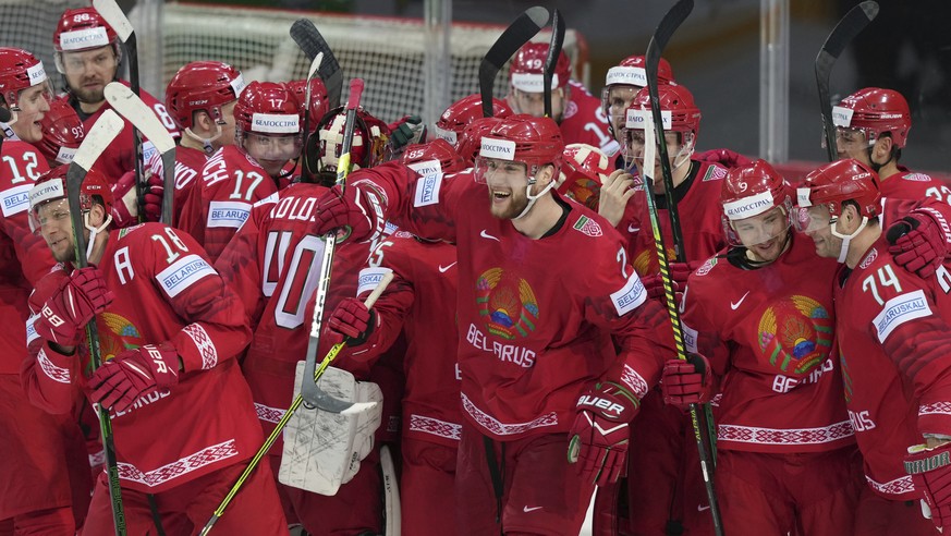 Belarus team player celebrate victory after the Ice Hockey World Championship group A match between the Sweden and Belarus at the Olympic Sports Center in Riga, Latvia, Sunday May 23, 2021. (AP Photo/ ...