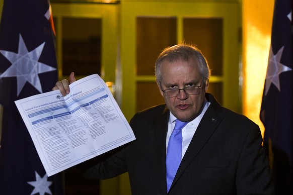 epa09378865 Australian Prime Minister Scott Morrison speaks to the media during a press conference following a national cabinet meeting, at the Lodge in Canberra, Australian Capital Territory, Austral ...