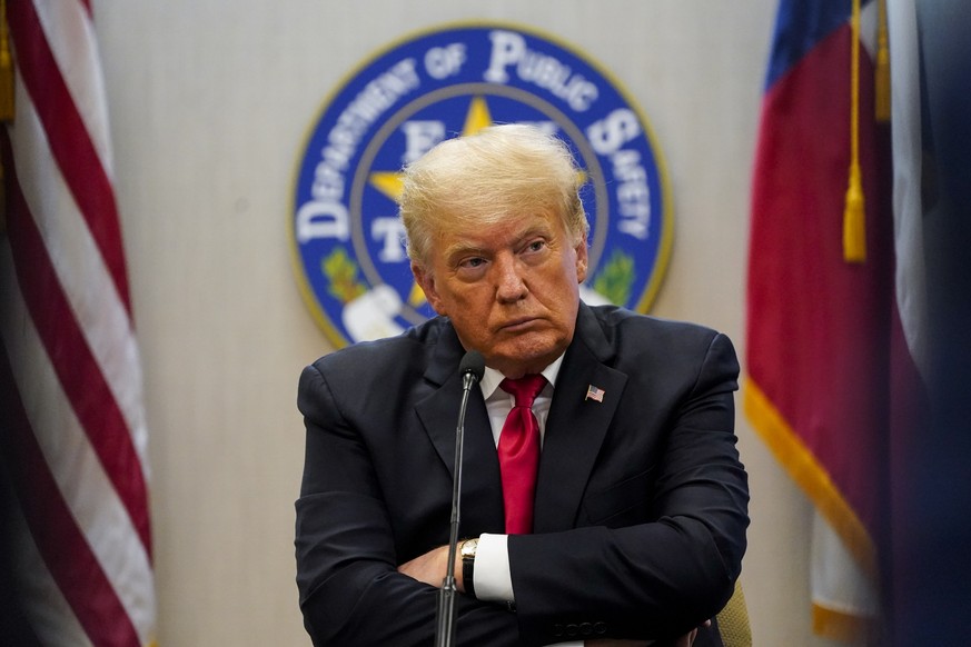Former President Donald Trump attends a briefing with state officials and law enforcement at the Weslaco Department of Public Safety DPS Headquarters before touring the US-Mexico border wall on Wednes ...