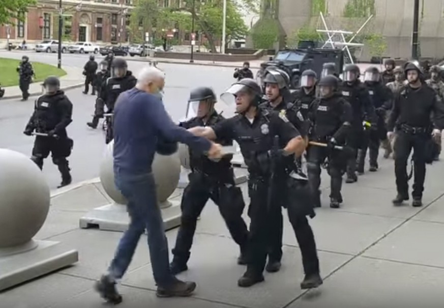 In this image from video provided by WBFO, a Buffalo police officer appears to shove a man who walked up to police Thursday, June 4, 2020, in Buffalo, N.Y. Video from WBFO shows the man appearing to h ...