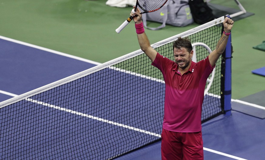 Stan Wawrinka, of Switzerland, raises his arms after defeating Juan Martin del Potro, of Argentina, during the quarterfinals at the U.S. Open tennis tournament, early Thursday, Sept. 8, 2016, in New Y ...