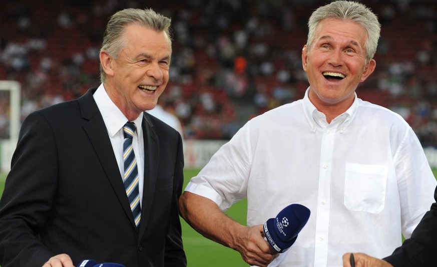 Bayern&#039;s former coach and current head coach of Switzerland&#039;s national soccer team, Ottmar Hitzfeld, left, and Bayern&#039;s coach Jupp Heynckes, right, laugh before the Champions League qua ...