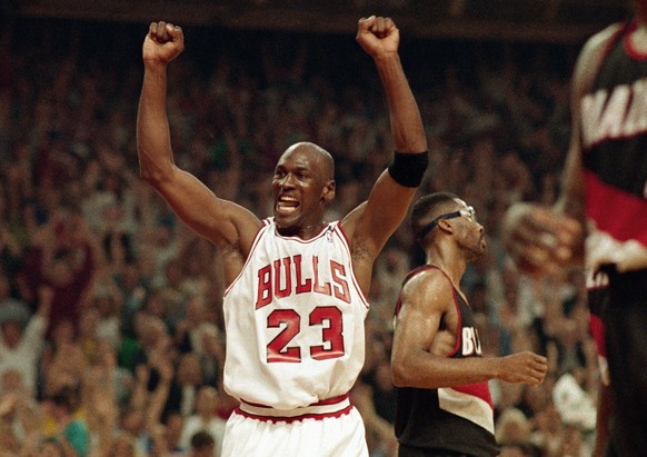 FILE - In this June 14, 1992, file photo, Michael Jordan celebrates the Bulls win over the Portland Trail Blazers in the NBA Finals in Chicago. Decades after Jordan&#039;s groundbreaking departure fro ...