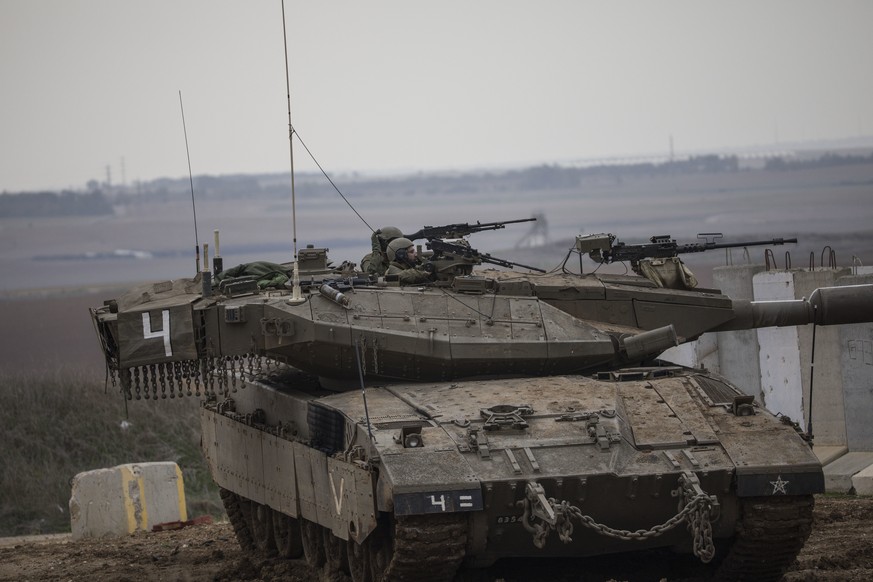 An Israeli army tank on the Israel Gaza border, Friday, Nov. 16, 2018. (AP Photo/Tsafrir Abayov)