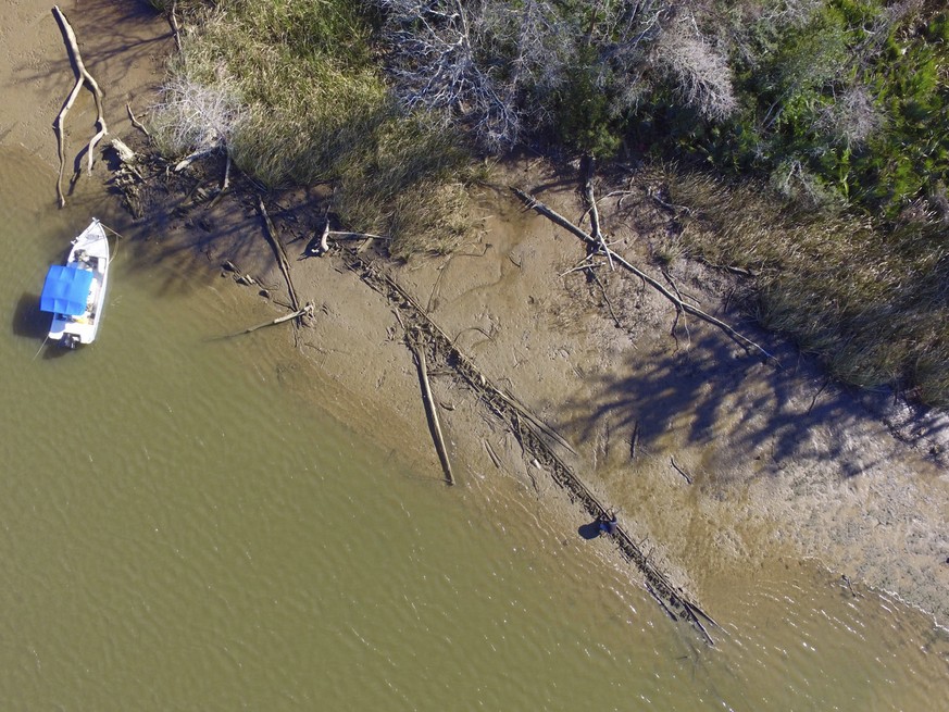 This aerial photo taken Tuesday, Jan. 2, 2018, in Mobile County, Ala., shows the remains of a ship that could be the Clotilda, the last slave ship documented to have delivered captive Africans to the  ...