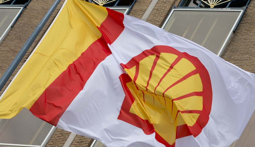 FILE - In this Monday, April 7, 2014 file photo, a flag bearing the company logo of Royal Dutch Shell, an Anglo-Dutch oil and gas company, flies outside the head office in The Hague, Netherlands. Roya ...
