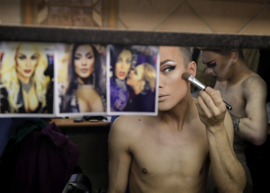 In this picture taken Sunday, June 24, 2018, Andrei, who uses the stage name Star Vasha applies make up on before performing at a Gay club during the 2018 soccer World Cup in Yekaterinburg, Russia. Th ...