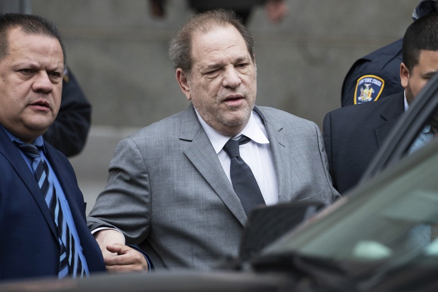 Harvey Weinstein, center, leaves court following a bail hearing, Friday, Dec. 6, 2019 in New York. (AP Photo/Mark Lennihan)