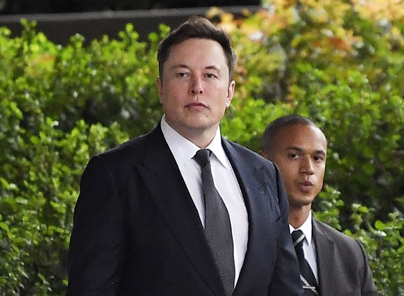 FILE - In this Wednesday, Dec. 4, 2019 file photo, Tesla CEO Elon Musk arrives at U.S. District Court in Los Angeles. Musk did not defame a British cave explorer when he called him â??pedo guyâ? in a ...
