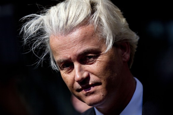 In this May 12, 2014 file photo Dutch lawmaker Geert Wilders pauses, as he speaks to journalists outside the Dutch National Bank in Amsterdam. The politically charged hate speech trial of Dutch firebr ...