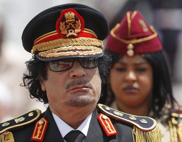 epa03728251 (FILE) A file picture dated 10 June 2009 shows former Libyan leader Muammar Gaddafi&#039;s disembarking from an airplane after its arrival in Ciampino&#039;s military airport near Rome, It ...