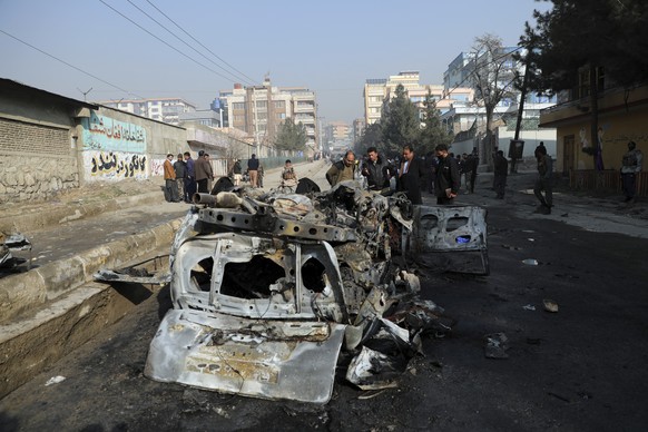 Afghan security officers inspect the site of a bomb attack in Kabul, Afghanistan, Sunday, Jan. 10, 2021. A roadside bomb exploded in Afghanistan&#039;s capital Sunday, killing at least a few people in ...