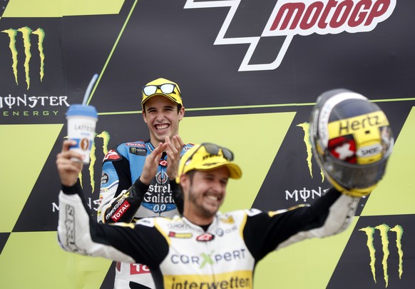 Second placed Spain&#039;s Alex Marquez of the EG 0,0 Marc VDS team applauds as Moto2 race winner Switzerland&#039;s Thomas Luthi of the CarXpert Interwetten celebrates after the Moto2 race at the Cze ...