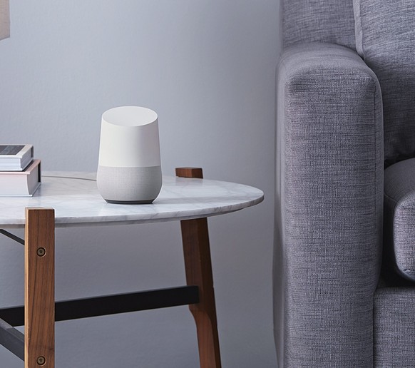 epa05315465 An undated handout made available by Google on 18 May 2016 shows Google Home (C) a voice-activated home product that will allow users to get answers from Google, stream music, and manage e ...