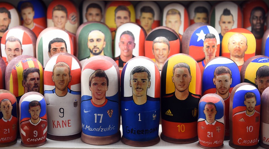 epa06885224 Matryoshka dolls depicting France&#039;s Antoine Griezmann (C-R) and Croatia&#039;s Mario Mandzukic (C-L) are on display in a souvenir shop in central Moscow, Russia, 13 July 2018. Croatia ...