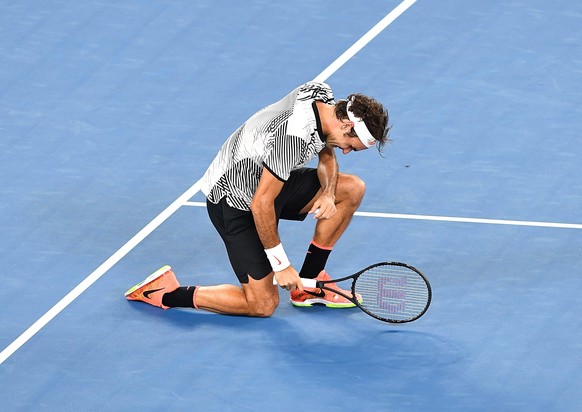 epa05759246 Roger Federer of Switzerland celebrates winning against Rafael Nadal of Spain during the finals of the Men&#039;s Singles at the Australian Open Grand Slam tennis tournament in Melbourne,  ...