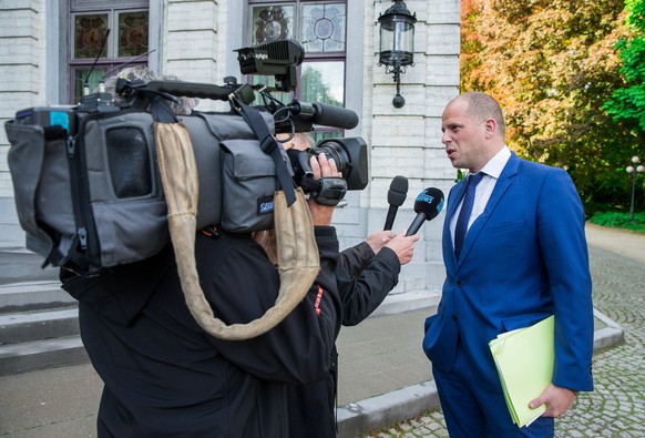 epa06296439 (FILE) - Belgian Secretary of State for Asylum, Migration and Administrative Simplification Theo Francken (R) speaks with journalists as he attends an extraordinary Council of Ministers at ...